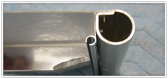 Close view of the ATL6 extrusion profile and its flat enclosure-track mounting surface