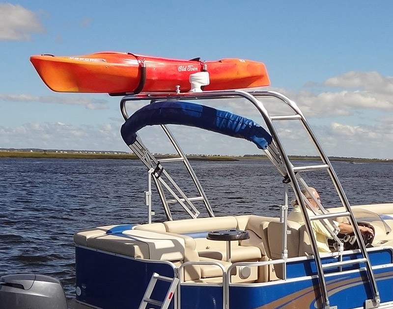 Kayak and paddleboard rack mounted to arch tubing