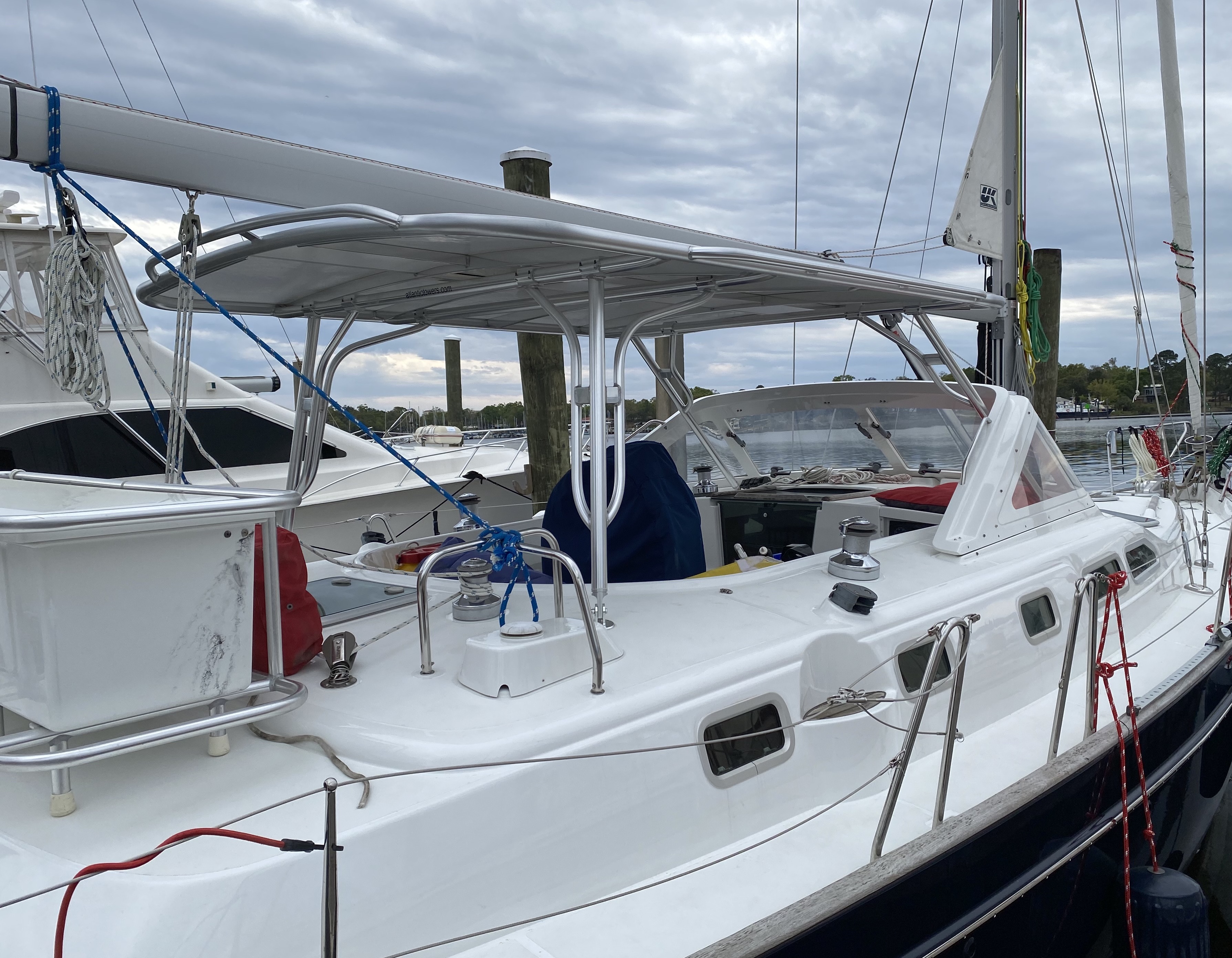 Beneteau 42CC Hard Dodger installation with a solar-ready roof